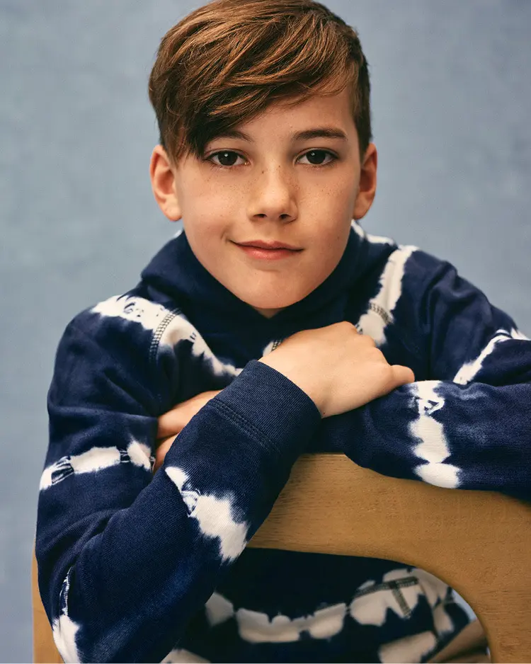 Boy wearing a tie-dye hooded sweatshirt